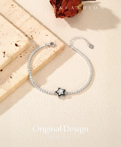 Detail of S925 sterling silver tennis bracelet with star pendant and lobster clasp