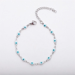 Detailed view of stainless steel evil eye bracelet with blue pupil charms and lobster clasp