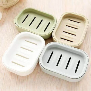 Detailed top view of four-color plastic soap dishes with double-layer drainage structure