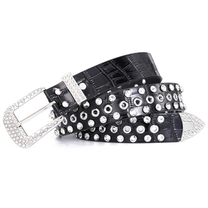 Women's black crocodile leather belt with rhinestones and metal eyelets on white background