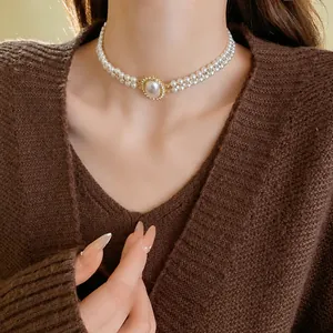 French vintage double-layered pearl choker necklace with a crystal-rimmed oval pearl