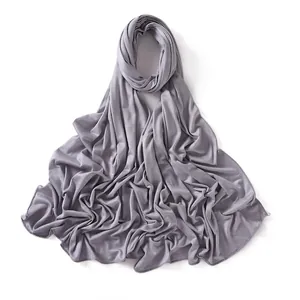 Detail of soft grey mercerized cotton jersey hijab with elegant draped folds and fine stitching