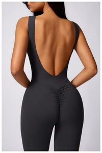 Detail view of deep U-shaped backless yoga jumpsuit with ruched peach lifting design