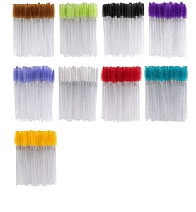 Macro shot of colorful spiral eyelash brushes with glittery transparent handles