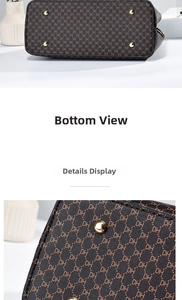 Detail view of the brown monogram leather bag with protective gold metal bottom studs