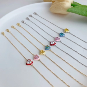 Close-up of S925 sterling silver bracelets with colorful enamel hearts and zircons