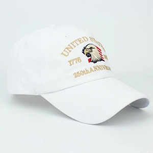 Close-up of gold 250th Anniversary embroidery on a white breathable cotton baseball cap