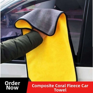Detailed texture of thick microfiber towel drying a white car window surface