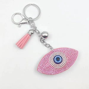 Sparkling pink Evil Eye keychain with rhinestone embellishments and a matching silk tassel