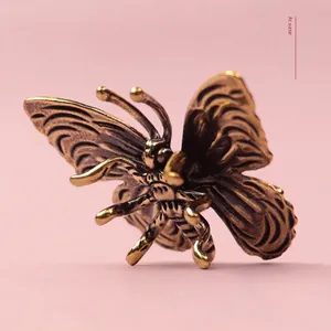 Vintage solid brass butterfly ornament with antique finish and detailed wing textures