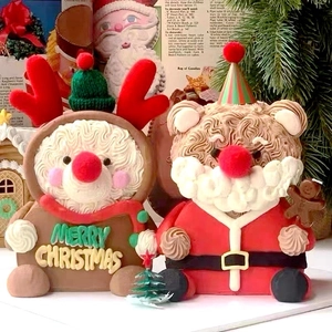 Close-up of reindeer and Santa bear edible cake toppers for Christmas dessert decoration