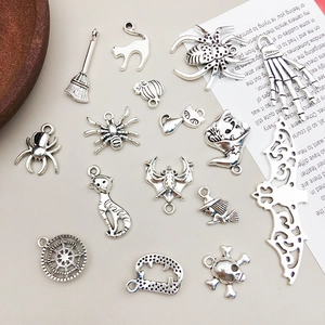 Vintage antique silver Halloween alloy charms featuring spiders, bats and skulls