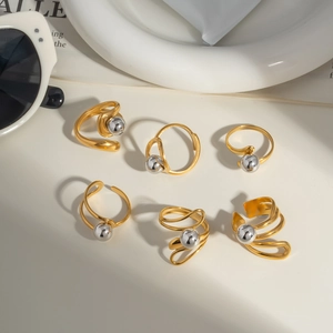 Set of six minimalist gold and silver beaded stainless steel rings in modern stackable design