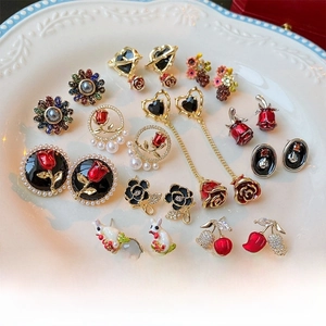 Detailed collection of tulip, rose, and pearl earrings with gold-plated finish