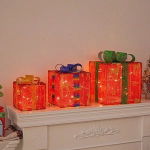 Three-piece glowing red Christmas gift box set with festive LED lights and colorful bows