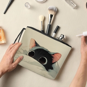 Portable cat printed makeup bag with brushes and perfume in a warm lifestyle scene