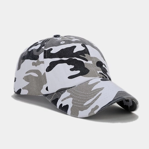 Macro side view of urban camouflage baseball cap showing cotton twill fabric and ventilation holes