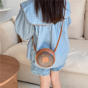 Cute round doughnut-shaped girls crossbody bag in brown with Hello print and strap