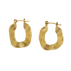Macro detail of gold U-shaped earrings featuring a vintage pleated texture and 18K finish