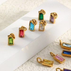Detail of 18K gold-plated rectangle birthstone charms with colorful inlaid crystals