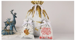 Three-piece Christmas drawstring gift bags with reindeer pattern and festive text decor