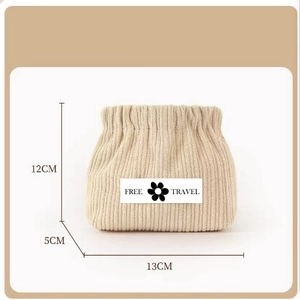 Detailed view of beige corduroy pouch with dimensions 12cm x 13cm and Free Travel label