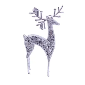 Elegant hollow silver reindeer ornament with intricate scroll patterns for Christmas decor