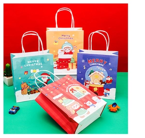 Close-up of Merry Christmas paper gift bags with snowman and reindeer cartoon prints