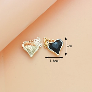 Detailed view of black crystal heart pendant with gold wings and size dimensions
