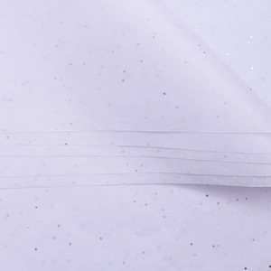 Macro detail of translucent lavender flower wrapping paper with holographic glitter sparkles