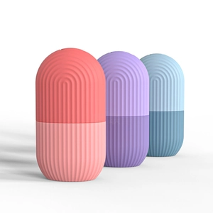 Detailed view of pink, purple and blue silicone face ice rollers with ripple texture
