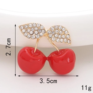 Detail view of crystal cherry accessory showing dimensions of 2.7cm by 3.5cm and 11g weight