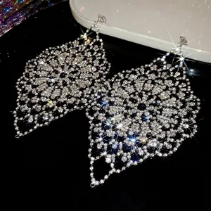 Sparkling silver diamond rhombus hollow round tassel earrings for elegant women's wear