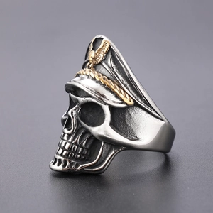 Macro shot of punk skull ring with officer hat and golden eagle emblem detail