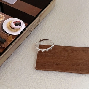 Detailed view of 925 sterling silver minimalist ring with geometric serrated texture