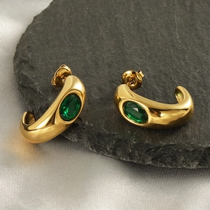 French vintage C-shape gold earrings with emerald green zircon stone on silk