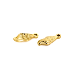 Macro detail of golden stainless steel wing pendants with high-gloss polished finish