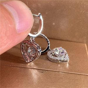 Exquisite silver heart-shaped hollow earrings with sparkling zircon stones