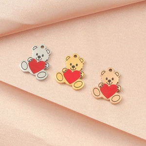 Stainless steel bear pendants with red hearts in silver, gold, and rose gold finishes