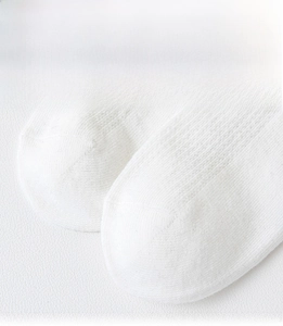 Close-up of seamless toe construction on white breathable mesh cotton socks for kids