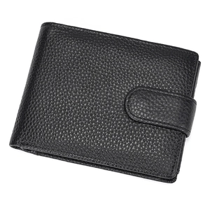 Detailed macro view of black genuine leather wallet with classic lychee pattern texture