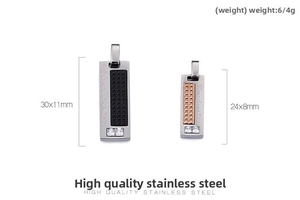 Detail view of engraved stainless steel rectangular pendants with crystals in black and rose gold