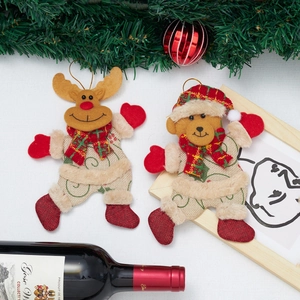 Detailed view of Christmas reindeer and bear plush ornaments with festive decorations