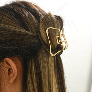 Elegant gold hollow cloud hair claw clip for women with minimalist metallic finish