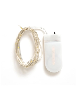 Detail of warm yellow LED string lights with transparent wire and a battery box