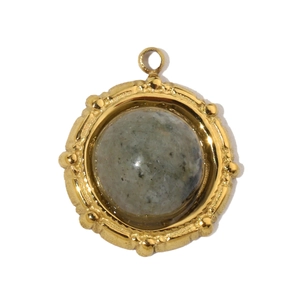 Macro view of gold-plated pendant featuring a gray marble stone with beaded edge detailing