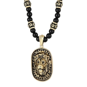 Retro lion head pendant necklace with black beads and gold-toned star pattern accents