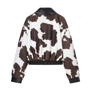 Short tie-dye jacket with cow print and black leather trim shown from the back view