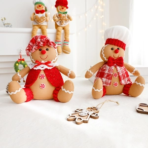 Adorable Christmas gingerbread man plush dolls in festive red and white knitted outfits