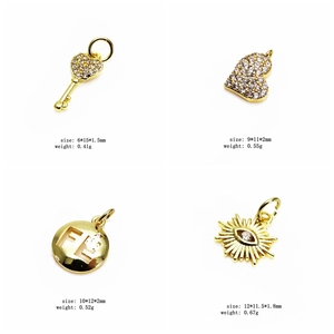 Detail view of gold charm pendants with dimensions and weight info for jewelry making